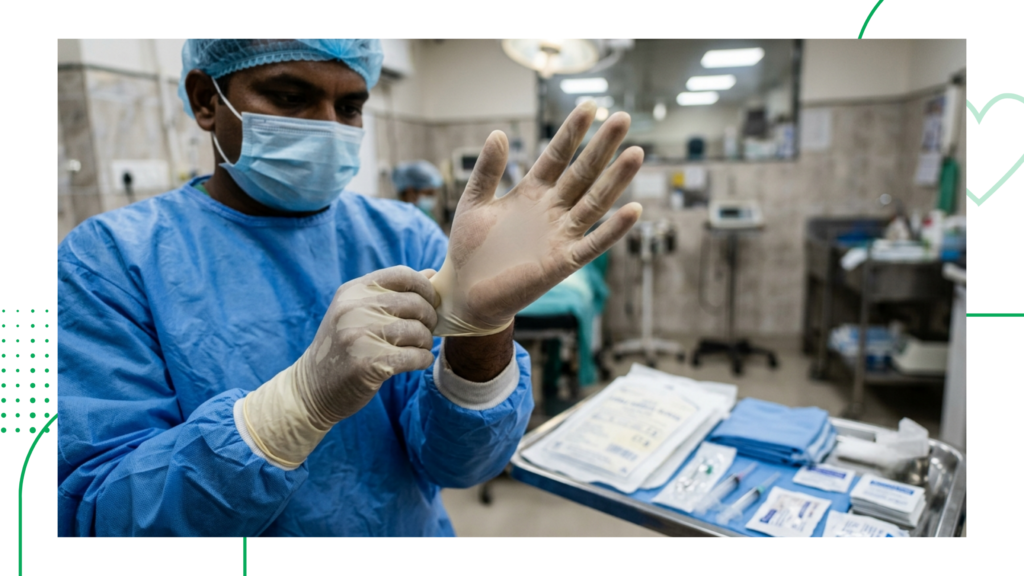 Close-up of a veterinary surgeon putting on sterile veterinary surgical gloves before a procedure.